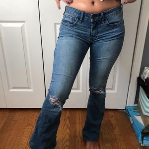 Hollister low rise flare jeans with rips on knees